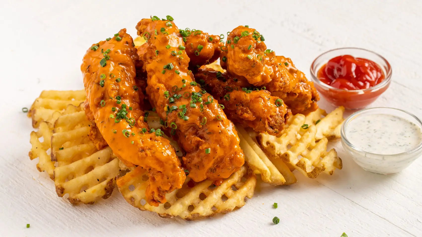 Bruxie's chicken tenders , fries and dipping sauces